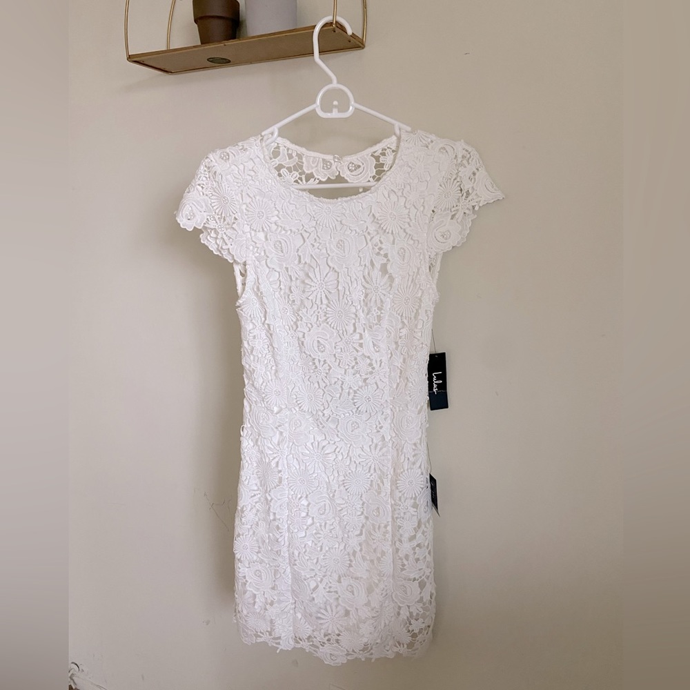 Brand new with tag, white backless lace Lulu’s dress, fit size 4-6.